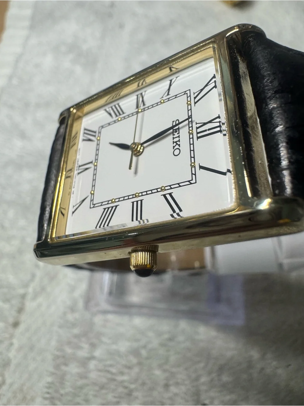 Seiko White Dial Watch with Black Strap and Gold Accents
